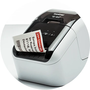 Brother QL desktop label printer with red and black label