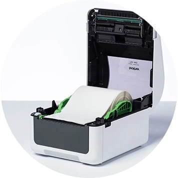 Brother TD-4D desktop label printer open with label roll inside