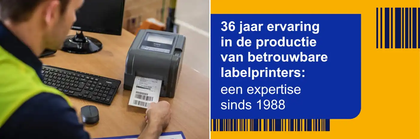 A male warehouse worker removing a barcode label from a Brother TD label printer while sat at a desk in front of a desktop computer