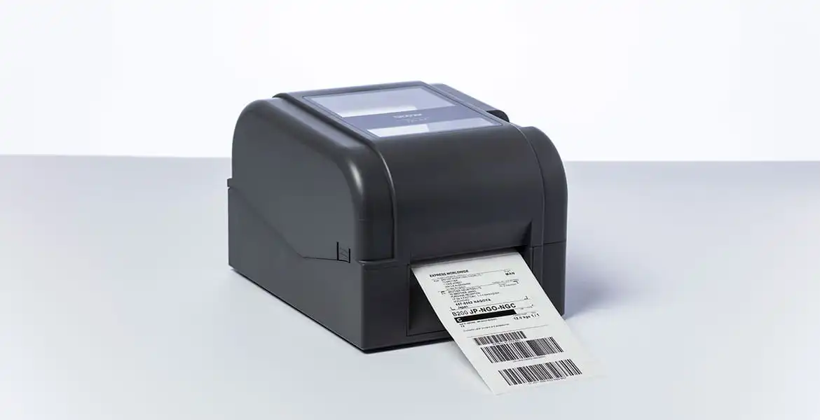 Brother TD-4T desktop label printer printing shipping label in studio