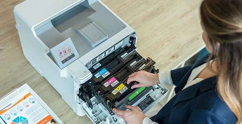 Female changing toners from a brother printer